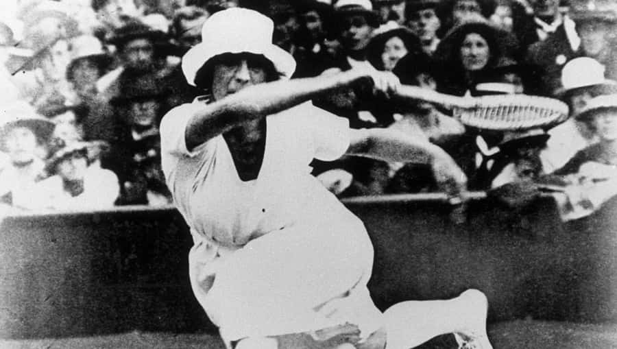 Suzanne Lenglen In Action During A Tennis Match Wallpaper