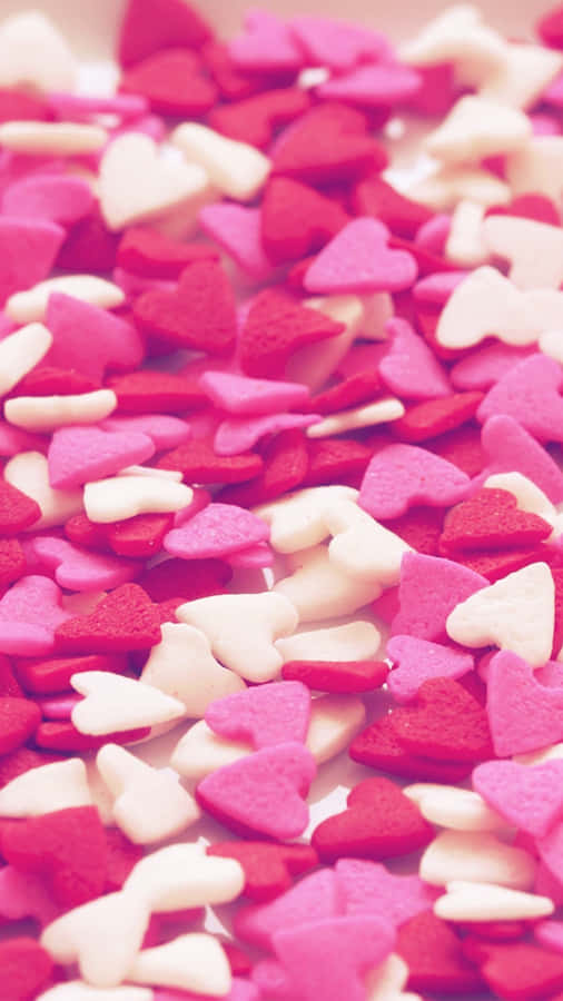 Sweet Candies Pink Heart Shapes Iphone Wallpaper