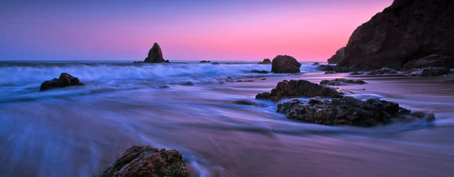 Take In The Beauty Of A Blue And Purple Sunset Wallpaper