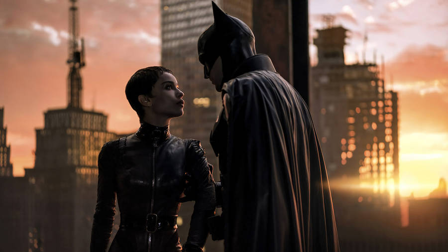The Batman Pulling Catwoman Close Wallpaper