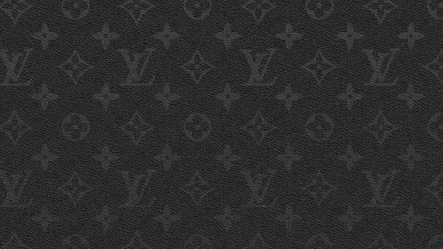 The Iconic Louis Vuitton Logo Atop A Brown Desktop Wallpaper