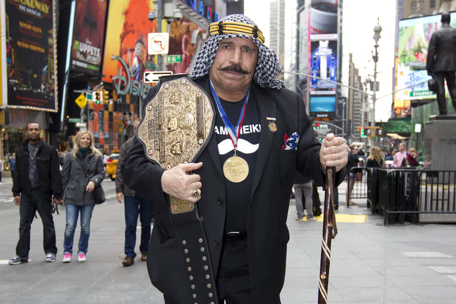 The Iron Sheik Holding Belt Wallpaper