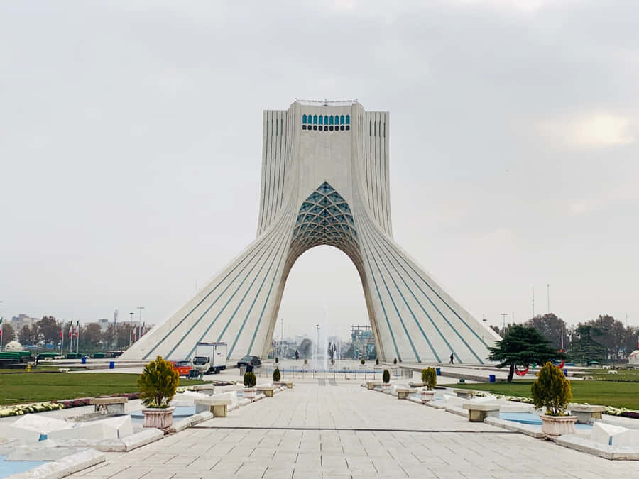 The Majestic Azadi Tower Standing Tall Amidst The Blue Skies Of Tehran. Wallpaper