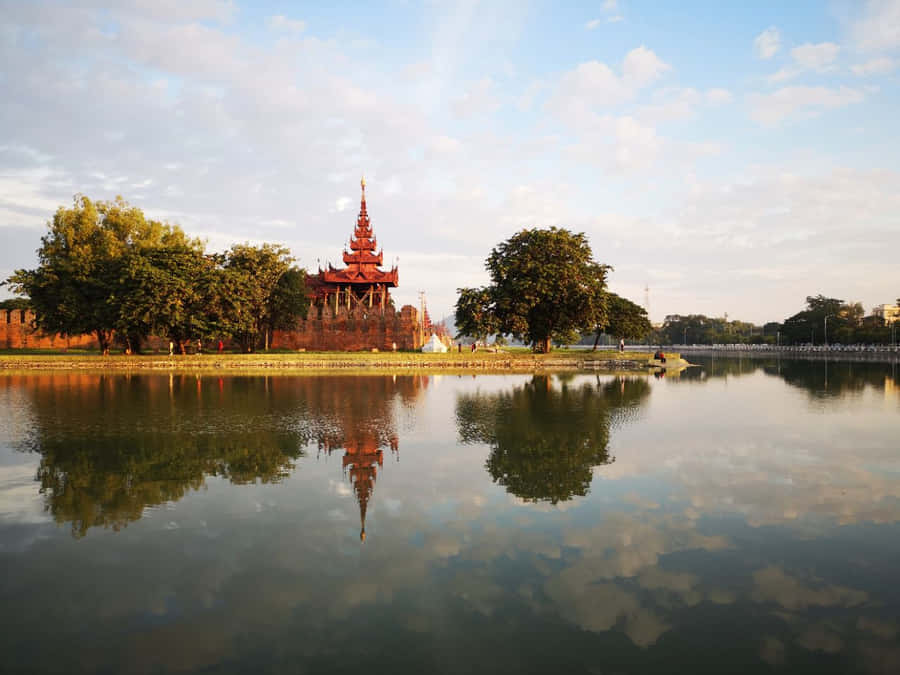 The Moat Centered By Lovely Trees At Mandalay Palace Wallpaper