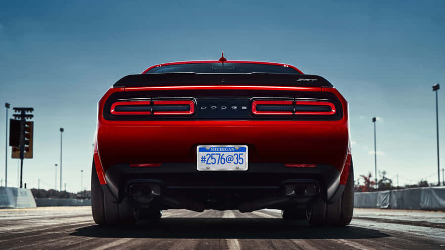 The Rear End Of A Red Dodge Challenger Wallpaper