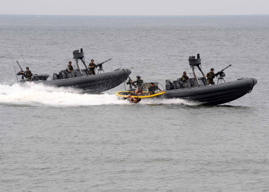 Three U S Navy Dinghies On A Mission Wallpaper