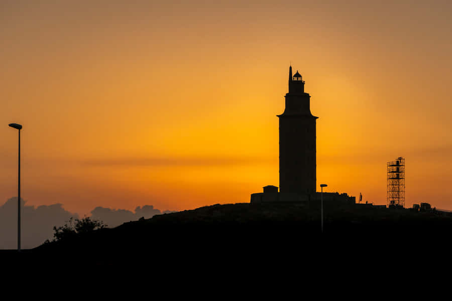 Tower Of Hercules At Sunset Orange Aesthetic Desktop Wallpaper
