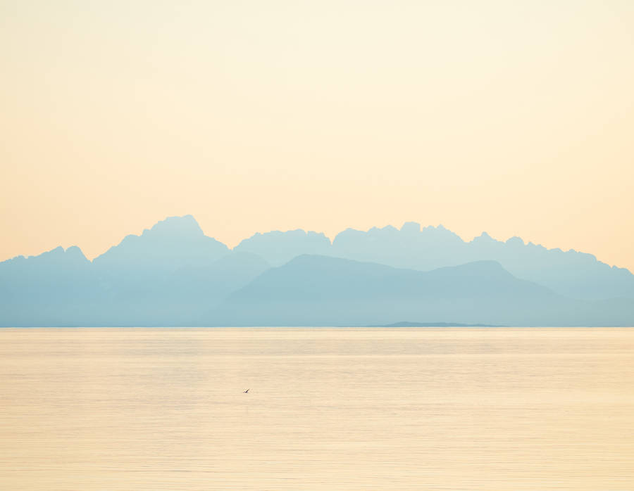 Towering Mountains And Dramatic Ombre Sky Wallpaper