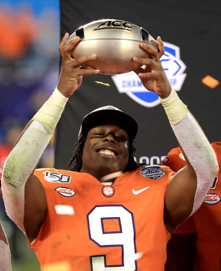 Travis Etienne With Acc Trophy Wallpaper