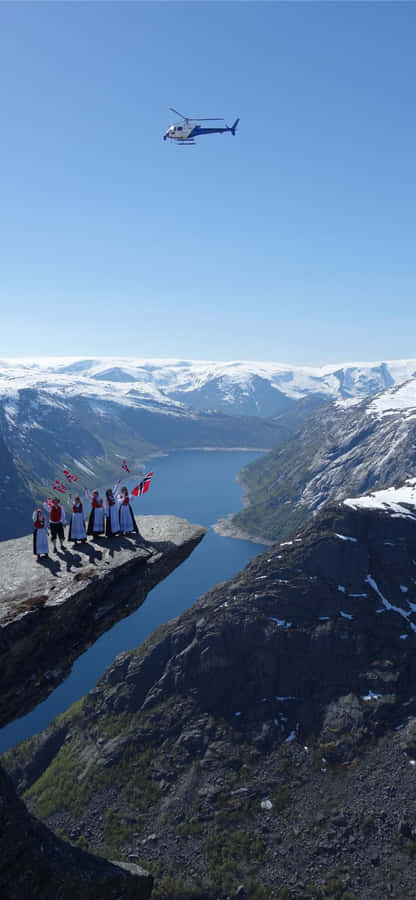 Trolltunga With Norwegian People Wallpaper