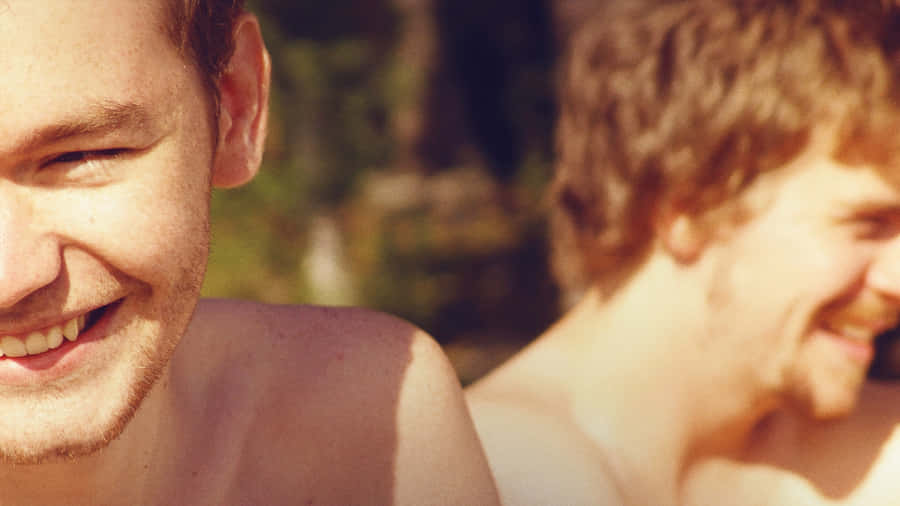 Two Gay Boys Laughing Up-close Wallpaper