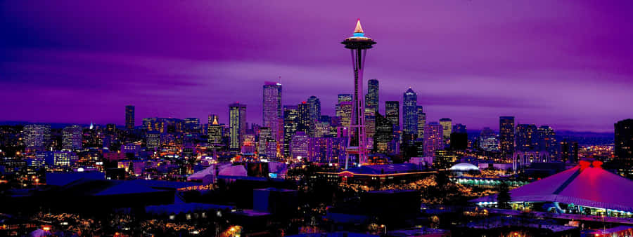 View Of The Beautiful Seattle Skyline At Sunset Wallpaper