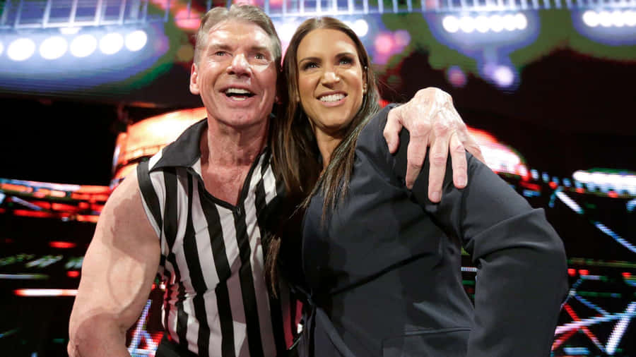 Vince Mcmahon And Stephanie Mcmahon Share A Moment Together Wallpaper