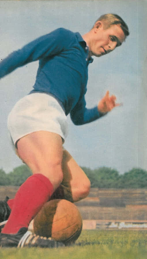 Vintage Football Player Action Shot Wallpaper