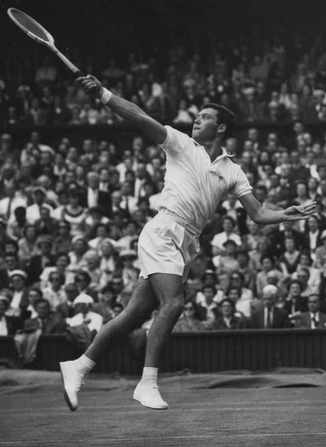 Vintage Tennis Player Action Shot Wallpaper
