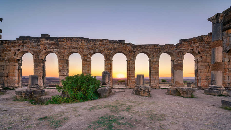 Volubilis Sunset Behind Arches Wallpaper