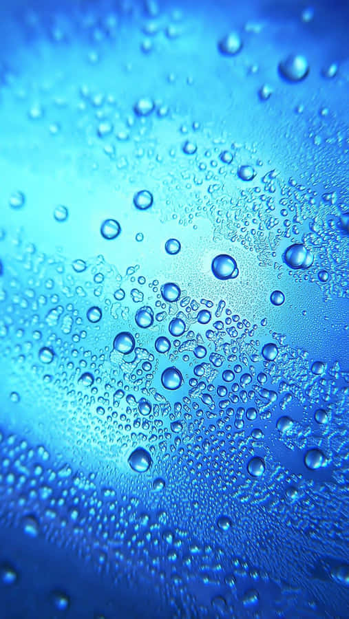 Water Droplets On A Blue Glass Wallpaper