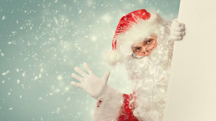 Waving Santa Claus In Snow Wallpaper