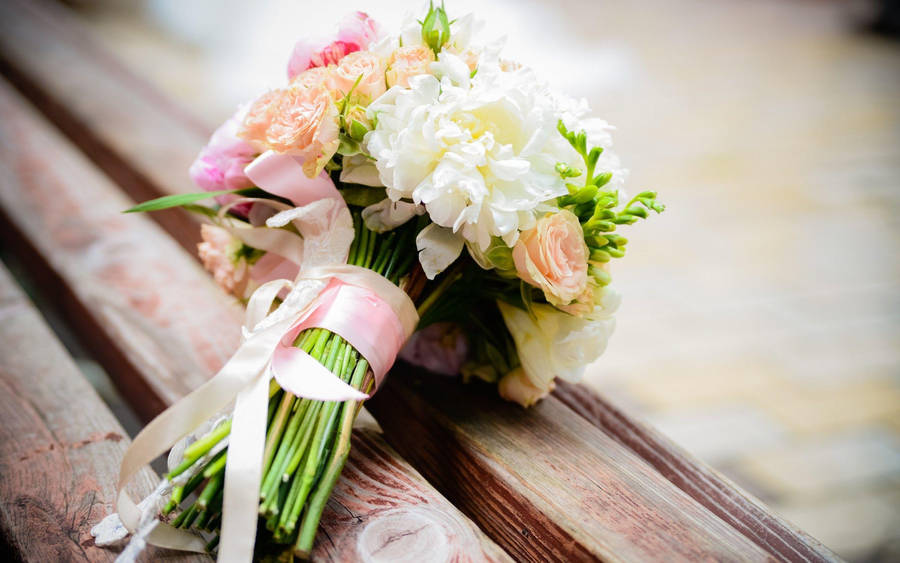 Wedding Bouquet On Wooden Bench Wallpaper
