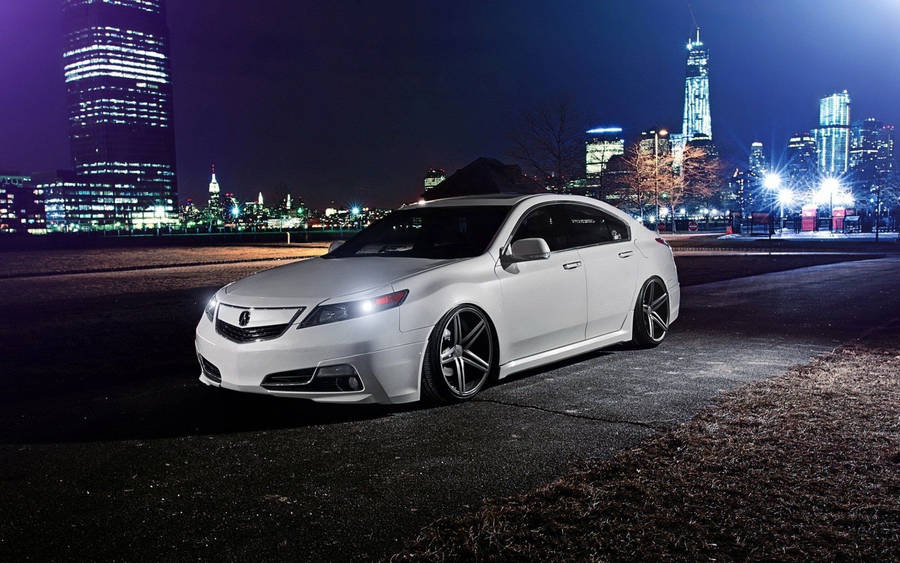 White Acura Car In Cityscape Wallpaper