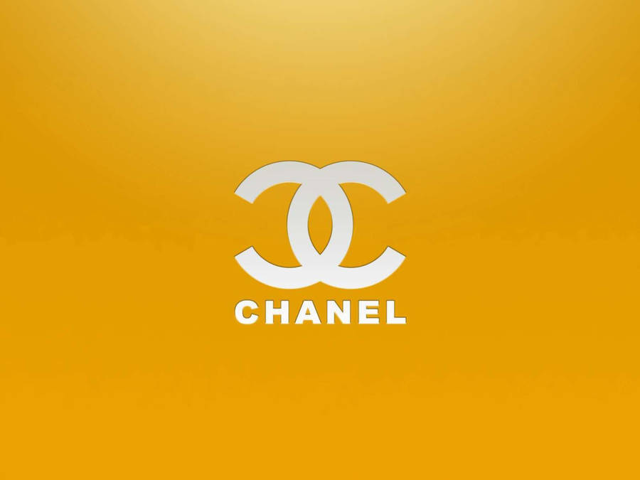 White Chanel Logo On Golden Yellow Wallpaper