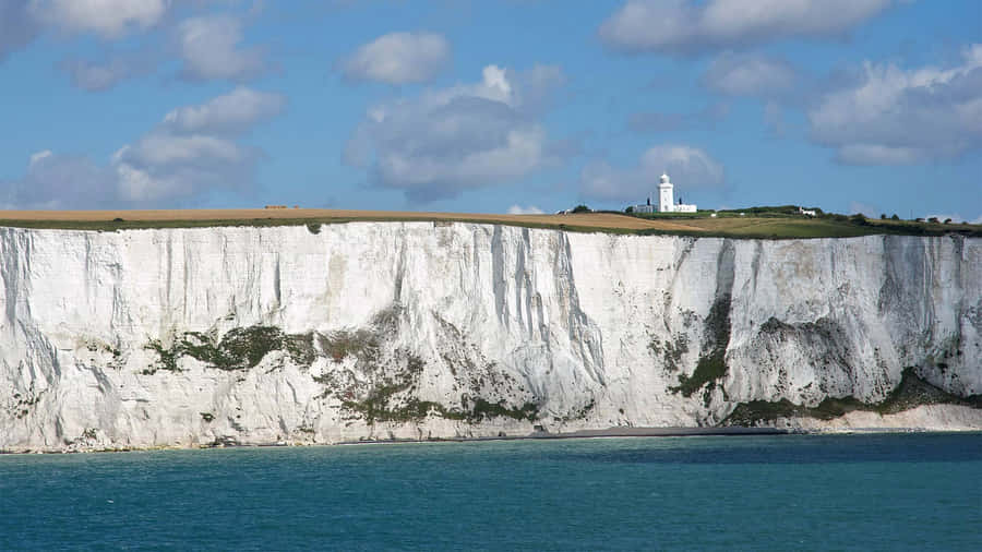 White Cliffs Of Dover Under The Cloudy Sky Wallpaper