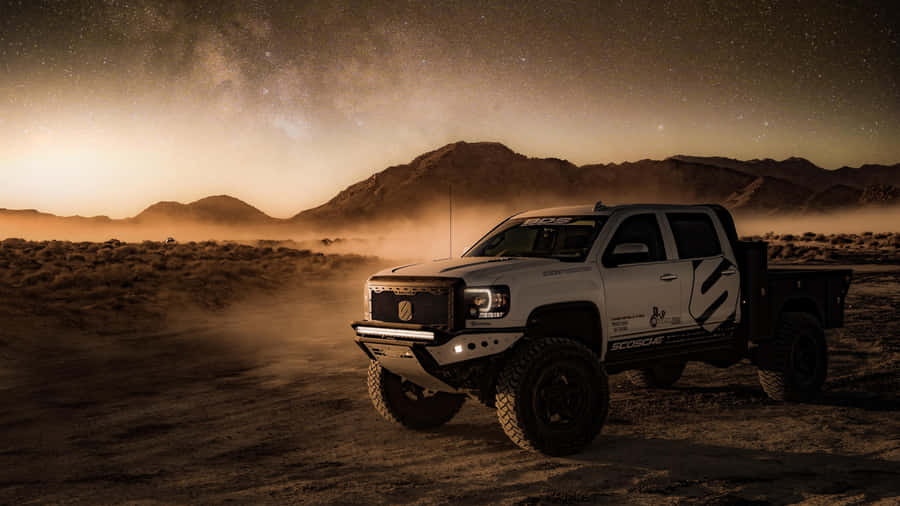 White Lifted Truck In The Dessert Wallpaper