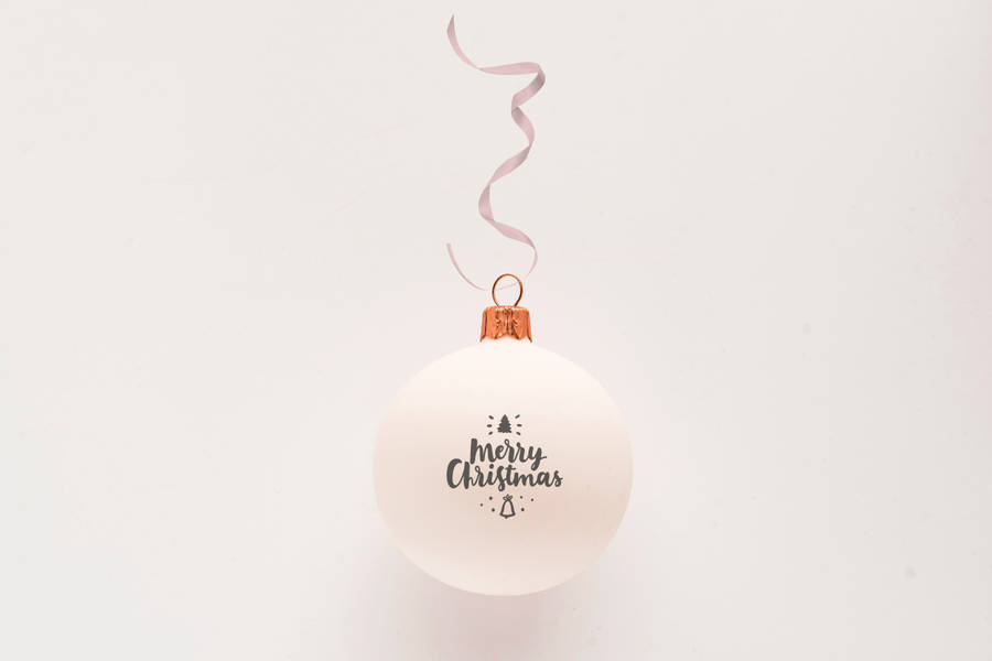 White Ornament With Merry Christmas And Ribbon Wallpaper