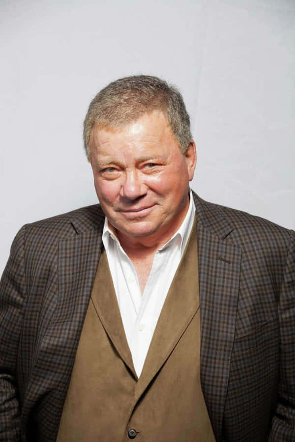 William Shatner Standing With A Confident Expression Wallpaper