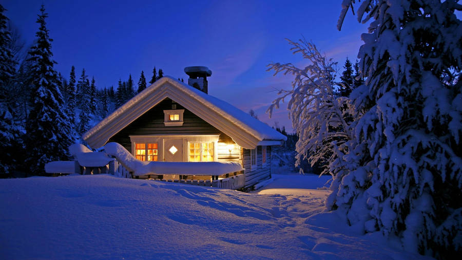 Winter House With A Lit Porch Wallpaper