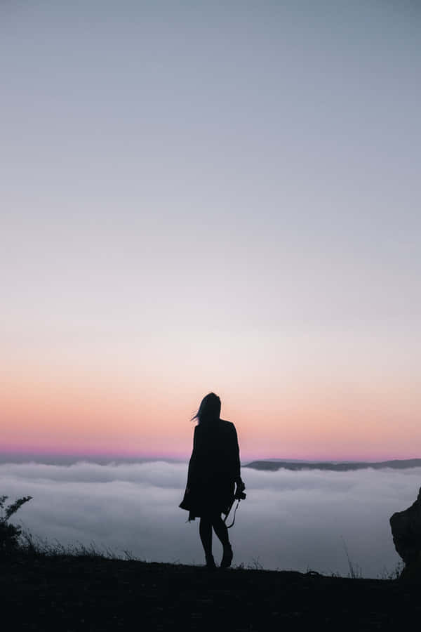 Woman Silhouette On Mountain Wallpaper