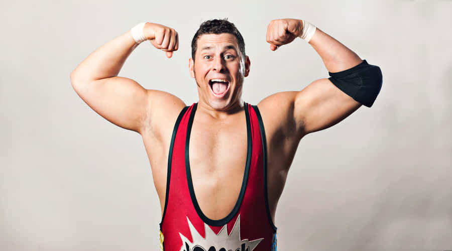 Wrestler Showing Off Muscles Wallpaper