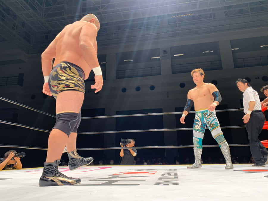 Wrestlers_ Facing_ Off_ In_ Ring.jpg Wallpaper