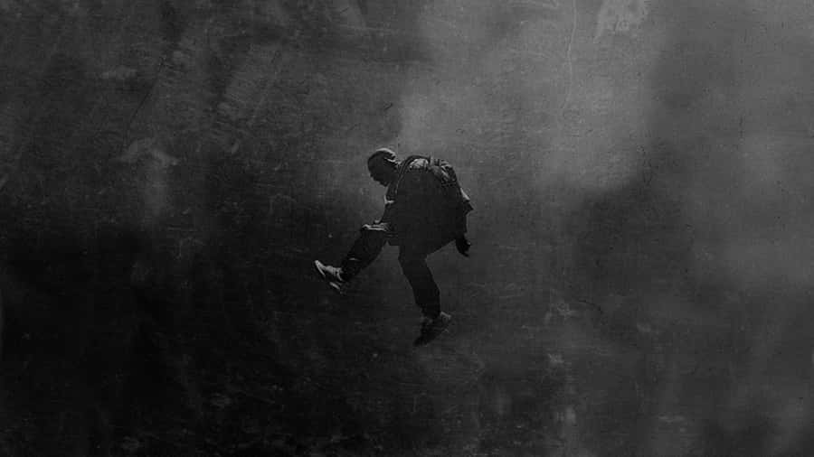 Xxxtentacion Listens To Music With His Laptop Wallpaper