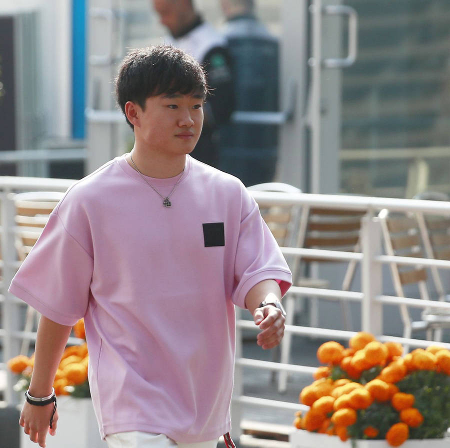 Yuki Tsunoda In Pink Polo Shirt Wallpaper