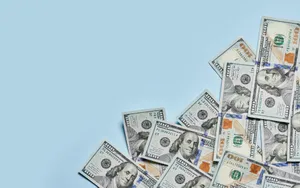 100 Dollar Bill Notes In Baby Blue Backdrop Wallpaper