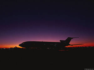 1024x768 Airplane At Sunset Wallpaper