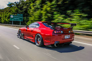 1998 Toyota Supra Mk4 On A Highway Wallpaper