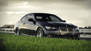 4k Bmw In Grass Wallpaper