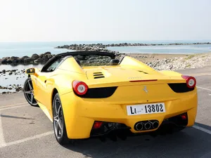 4k Ferrari Yellow Near Beach Wallpaper