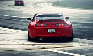 4k Jdm Red Toyota Supra On Road Wallpaper