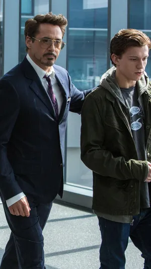 750x1334 Robert Downey Jr And Tom Holland In Spiderman Homecoming Wallpaper