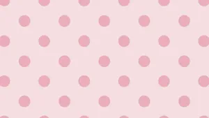 A Beautiful Pattern Of Pink And White Polka Dots. Wallpaper