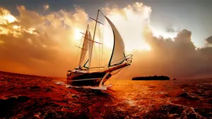 A Beautiful Ship Silhouetted Against A Vibrant Sunset Wallpaper
