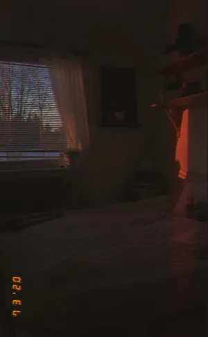 A Bed With A Blanket On It Wallpaper