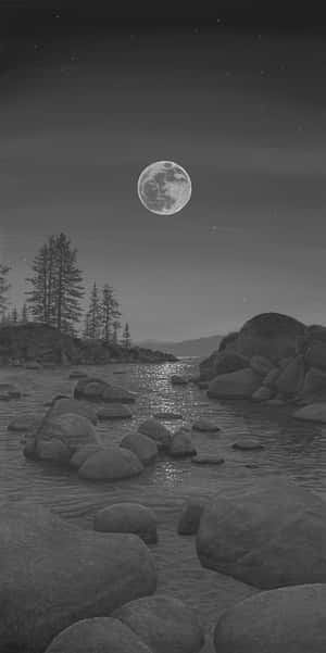 A Black And White Drawing Of A Moon Over A Lake Wallpaper