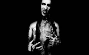 A Black And White Photo Of A Man With Dreadlocks Wallpaper