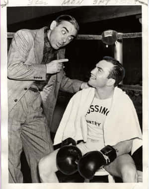 A Black And White Photo Of Two Men In Boxing Gloves Wallpaper