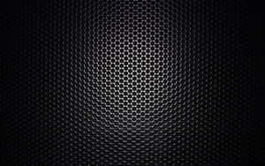 A Black Background With A Metal Grille Wallpaper