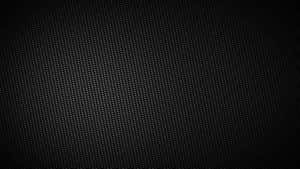 A Black Background With A Pattern Of Holes Wallpaper